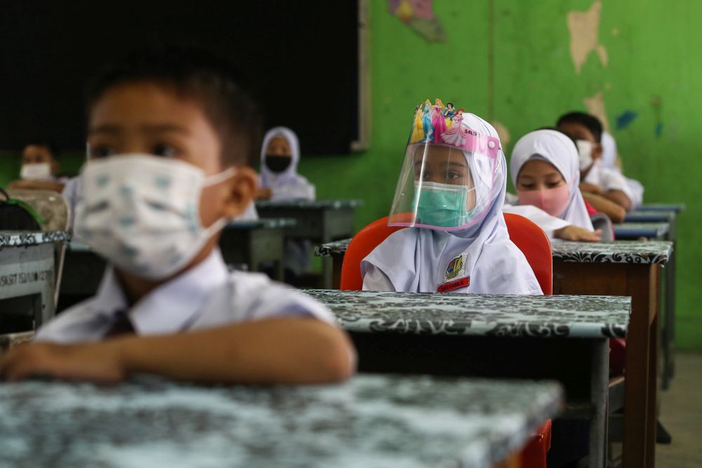 Sekolah Kebangsaan Section 7 students on their first day back at school in Shah Alam July 22, 2020. u00e2u20acu201d Picture by Yusof Mat Isa