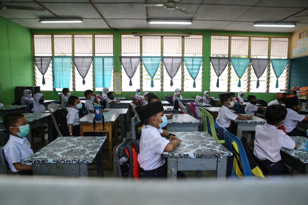 Sekolah Kebangsaan Section 7 students on their first day back at school in Shah Alam July 22, 2020. u00e2u20acu201d Picture by Yusof Mat Isa