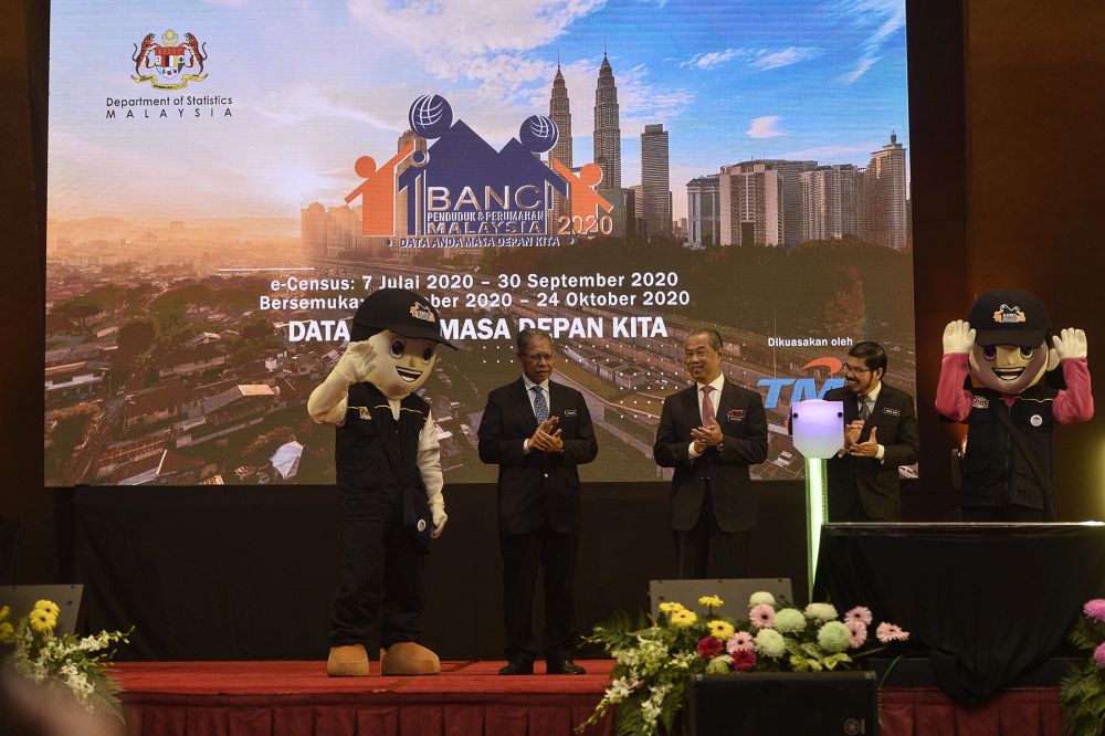 Prime Minister Muhyiddin Yassin (centre) is pictured at the launch of the Malaysian Population and Housing Census 2020 at the Putrajaya International Convention Centre July 7, 2020. u00e2u20acu201d Picture by Miera Zulyana