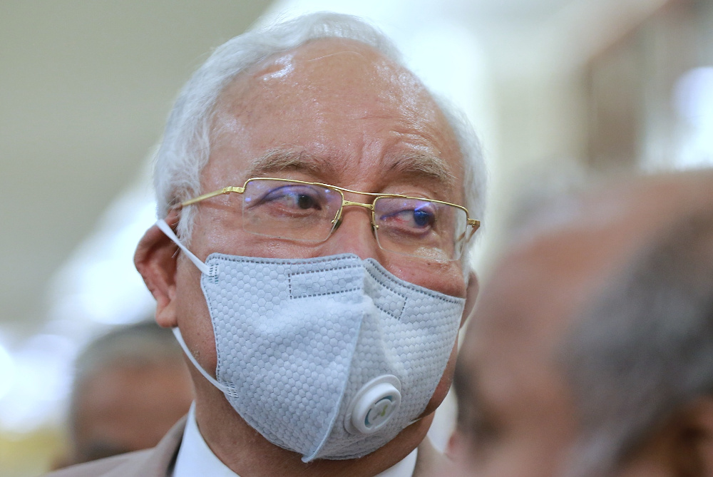 Datuk Seri Najib Razak leaves Kuala Lumpur High Court after he was found guilty of abuse of power and misappropriating RM42 million from SRC International Sdn Bhd July 28, 2020. u00e2u20acu201d Picture by Ahmad Zamzahuri