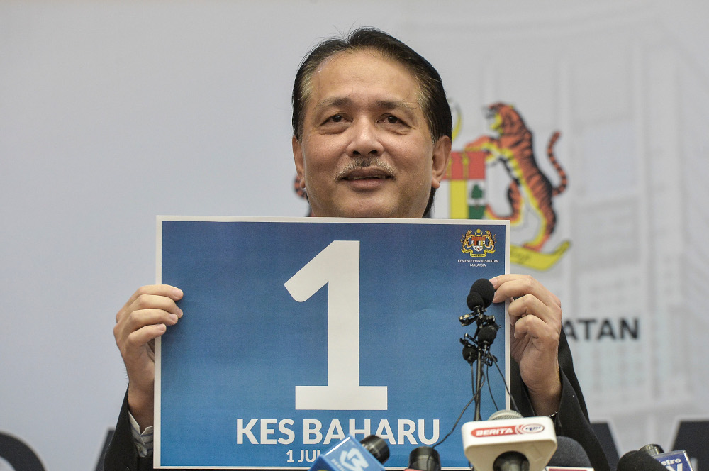 Health director-general Datuk Dr Noor Hisham Abdullah holding a poster showing the number of cases reported July 1, 2020 u00e2u20acu201d Picture by Shafwan Zaidonn