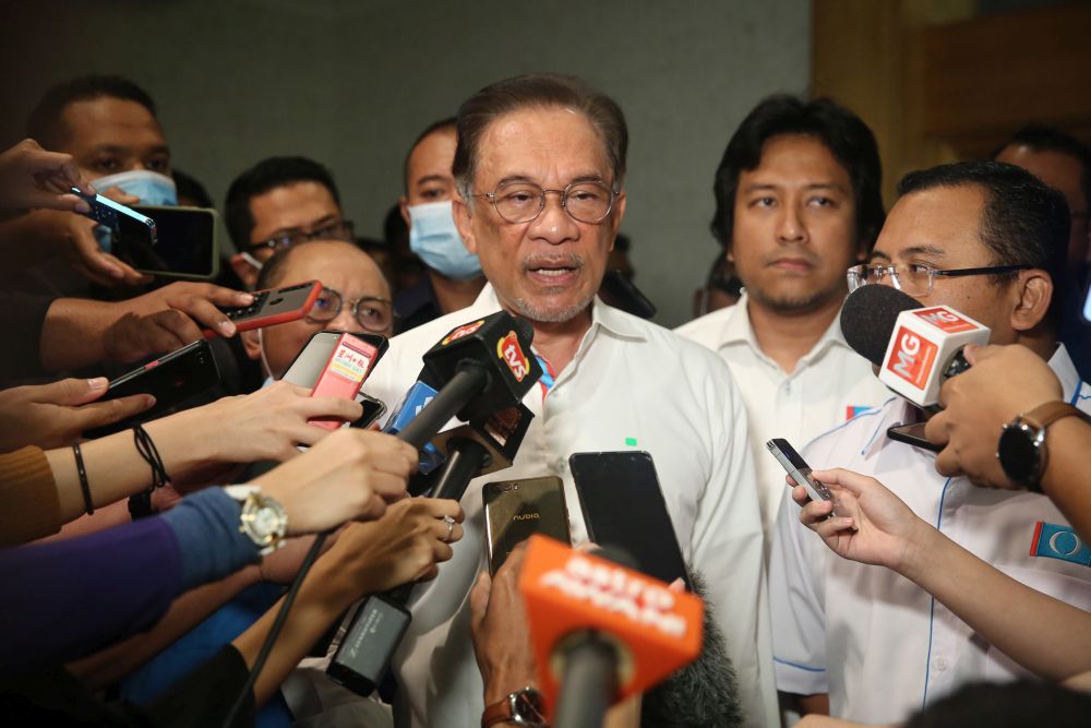 PKR president Datuk Seri Anwar Ibrahim (centre) speaks to reporters during the PKR Information Convention in Ampang July 26, 2020. u00e2u20acu201d Picture by Yusof Mat Isa