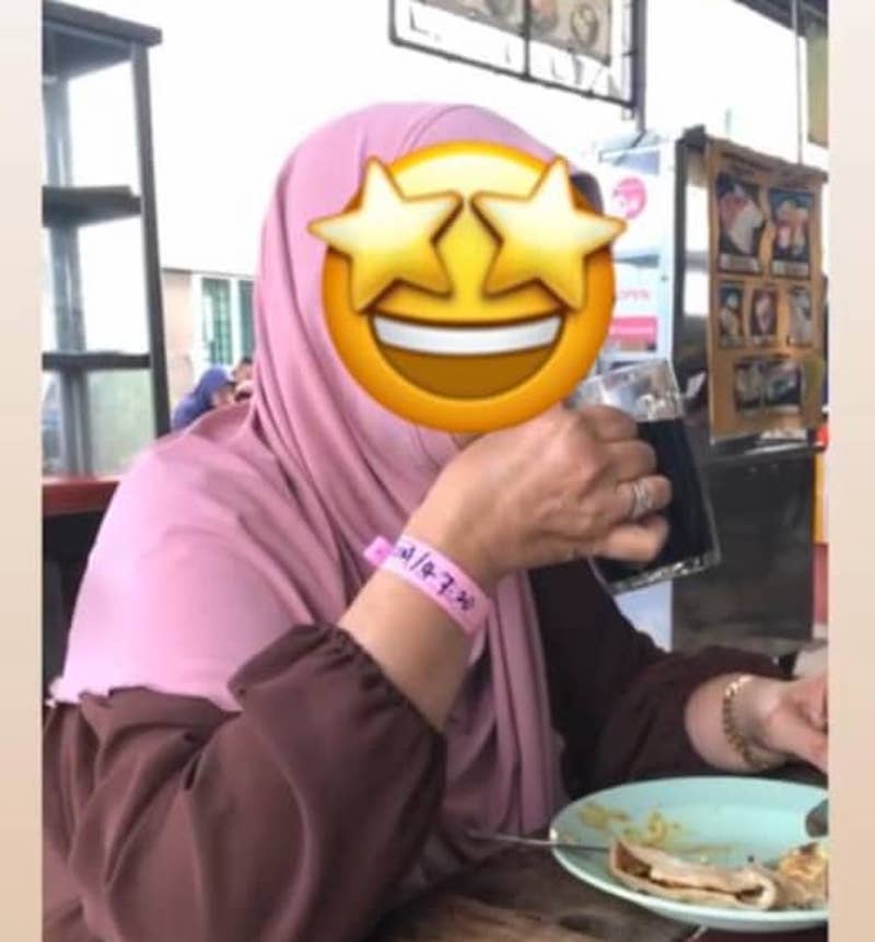 A picture of a woman wearing a Covid-19 quarantine wrist tag and dining at a restaurant in Bandar Meru Raya made the rounds on social media. u00e2u20acu201d Picture from social media