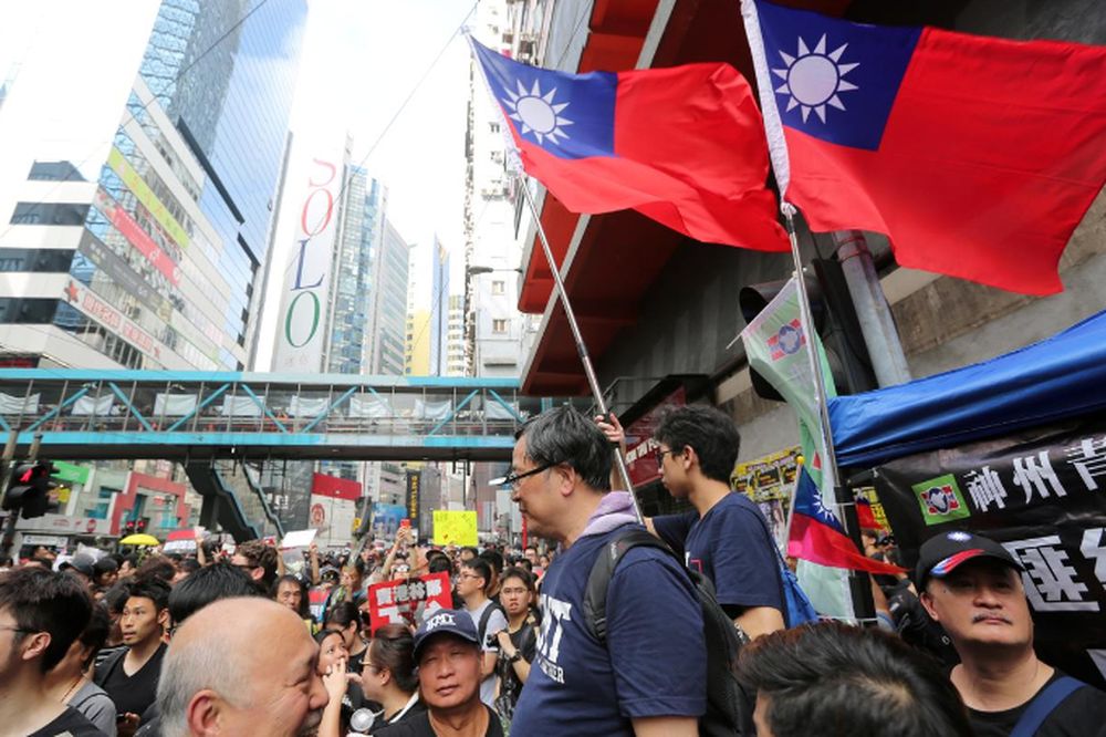 Taiwan flags are seen near protesters attending a demonstration to demand the resignation of Hong Kong leader Carrie Lam and the withdrawal of the extradition bill, in Hong Kong, China June 16, 2019. u00e2u20acu201d  Reuters pic