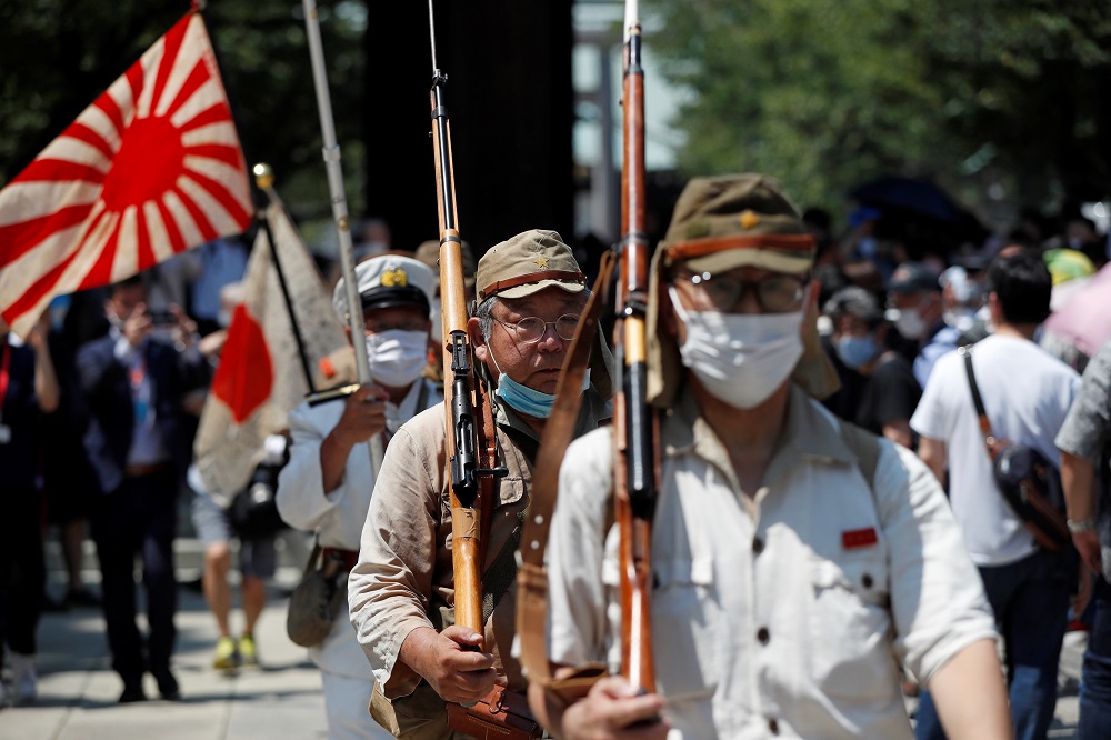 Men dressed in Japanese imperial military uniforms visit Yasukuni Shrine on the 75th anniversary of Japan's surrender in World War Two, amid the coronavirus disease pandemic, in Tokyo August 15, 2020. u00e2u20acu201d Reuters pic