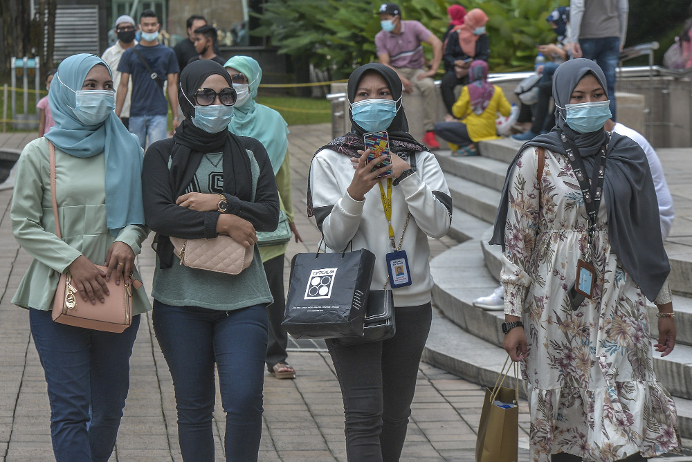 Pedestrians wearing face masks at a public area in Kuala Lumpur August 1, 2020. u00e2u20acu201d Picture by Shafwan Zaidon 