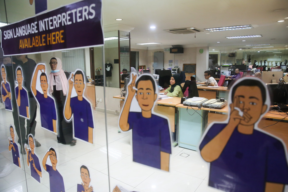 MFDu00e2u20acu2122s office is designed to be a deaf-friendly space with glass walls that allow people to tell if someone is approaching and a blinking light that acts as a doorbell. u00e2u20acu201d Picture by Choo Choy May