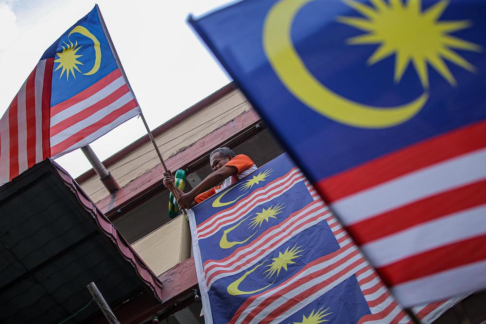 Malaysia flags are put up in conjunction with Merdeka celebrations at Kampung Baru low-cost flats, August 30, 2020. u00e2u20acu201d Picture by Hari Anggara