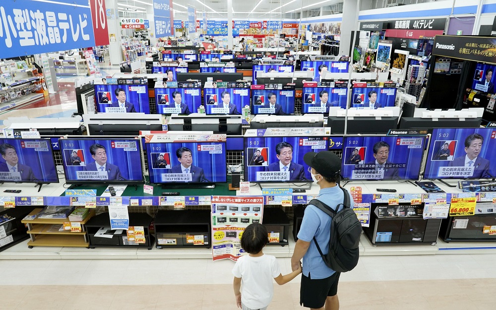 Television screens bradcasting a news conference of Japan's Prime Minister Shinzo Abe are seen at an electric store in Urayasu, east of Tokyo August 28, 2020. u00e2u20acu2022 Kyodo pic via Reuters