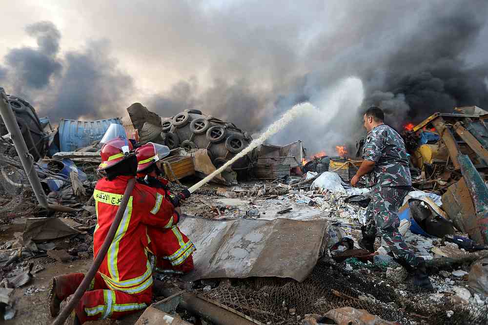 Firefighters spray water at a fire following an explosion in Beirut's port area, Lebanon August 4, 2020. u00e2u20acu201d Reuters pic