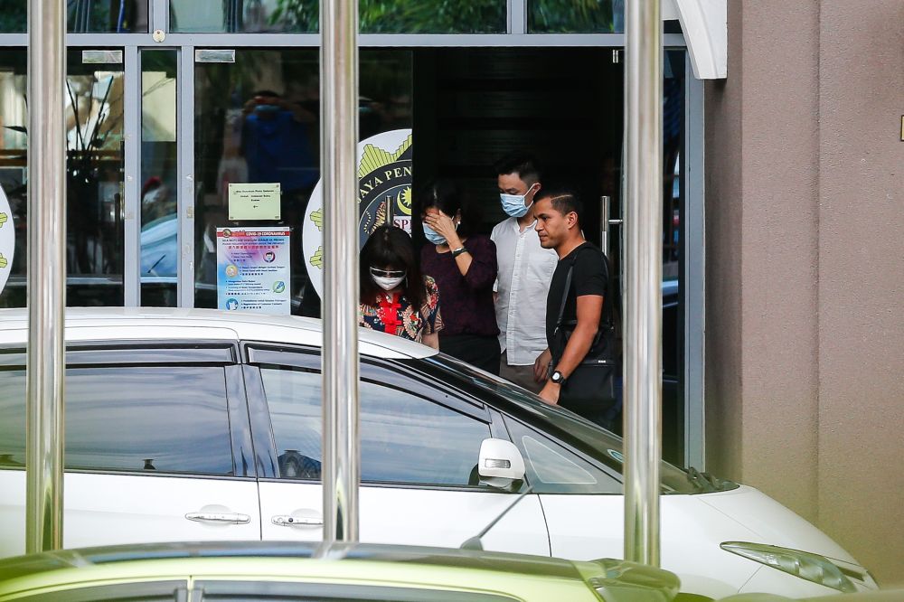 Betty Chew (second from left), wife of former finance minister Lim Guan Eng, leaves the MACC Penang branch in George Town August 7, 2020. u00e2u20acu201d Picture by Sayuti Zainudin
