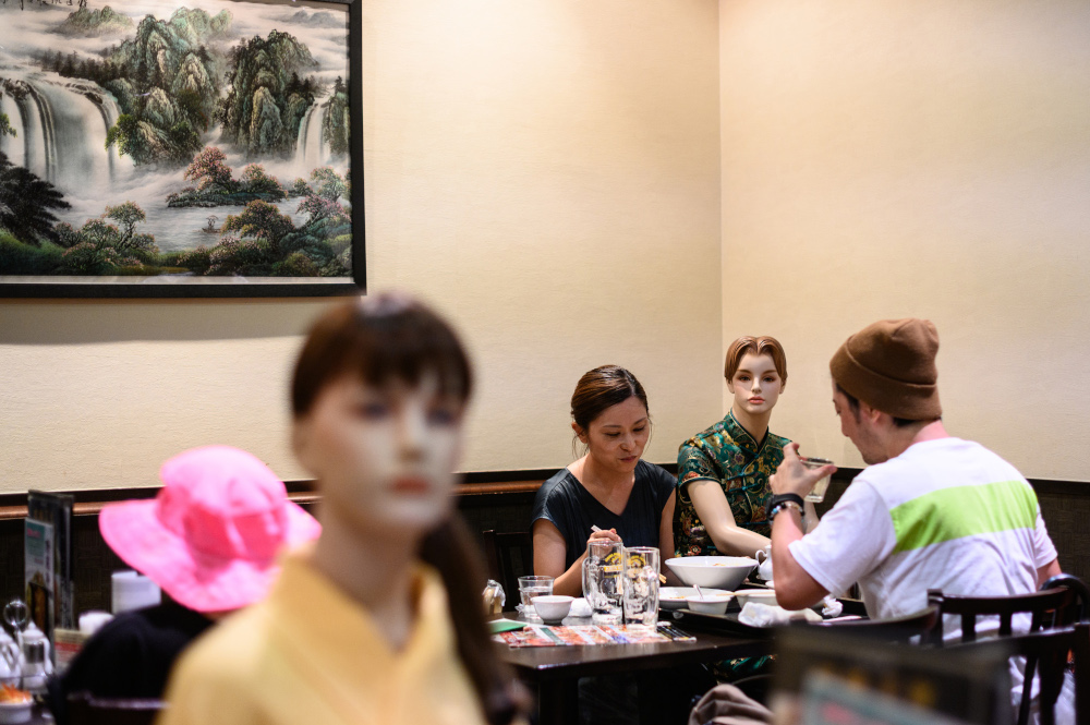 Diners eat alongside mannequins, used as a method to maintain social distancing among diners, at a restaurant in the Akabane district of Tokyo July 26, 2020, amid the Covid-19 coronavirus pandemic. u00e2u20acu201d AFP pic