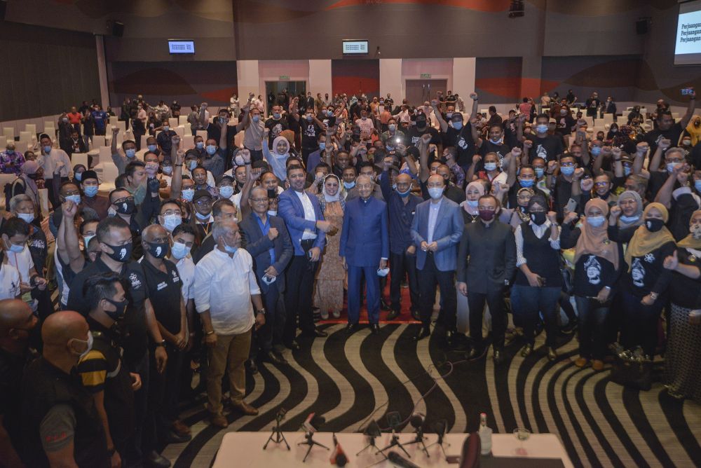 Tun Dr Mahathir Mohamad (centre) poses for a picture after a media conference at the Pullman Kuala Lumpur in Bangsar August 7, 2020. u00e2u20acu201d Picture by Shafwan Zaidon