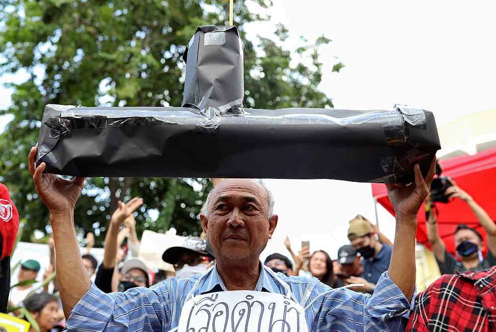 A man holds a paper submarine as he protests against Thai government plan to buy two new submarines from China at a rally in Bangkok, Thailand August 27, 2020. u00e2u20acu201d Reuters pic