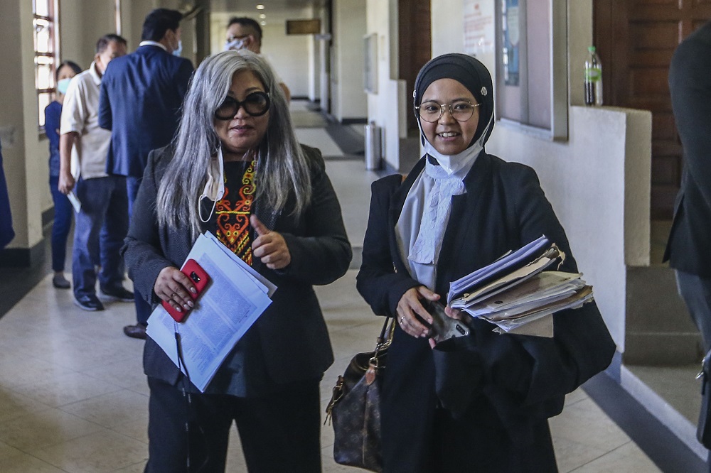 Human rights activist Siti Kasim is seen with her lawyer Suzana Norlihan Alias at the Kuala Lumpur Court Complex August 21, 2020. u00e2u20acu2022 Picture by Firdaus Latif 