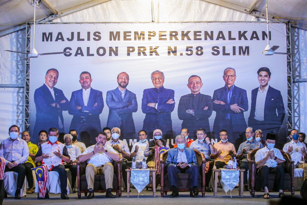 Tun Dr Mahathir Mohamad (front row, second from right) is pictured during the unveiling of Pejuang's candidate for the Slim by-election in Tanjung Malim August 12, 2020. u00e2u20acu201d Picture by Hari Anggara
