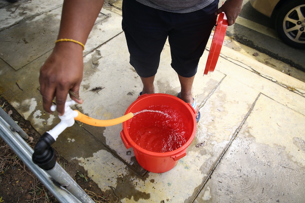 Residents of Setia Alam collect water from an Air Selangor water point following the water disruption in the Klang Valley September 6, 2020. u00e2u20acu201d Picture by Yusof Mat Isa
