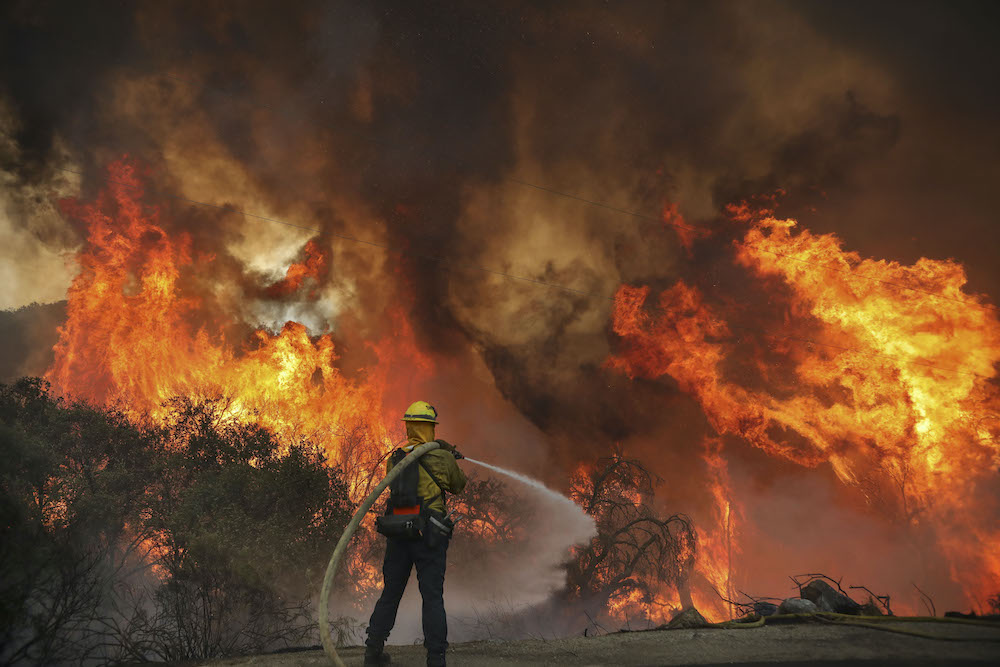 San Miguel County Firefighters battle a brush fire along Japatul Road during the Valley Fire in Jamul, California September 6, 2020. u00e2u20acu201d AFP pic