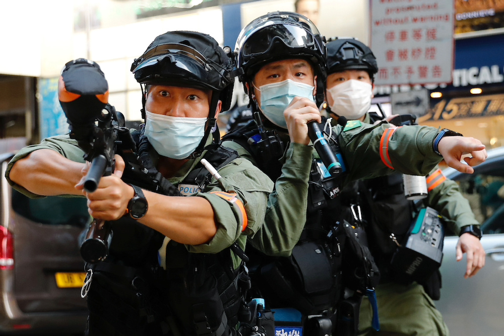 A riot police uses pepper spray gun to disperse pro-democracy protesters during a demonstration oppose postponed elections, in Hong Kong, China September 6, 2020. u00e2u20acu201d Reuters pic