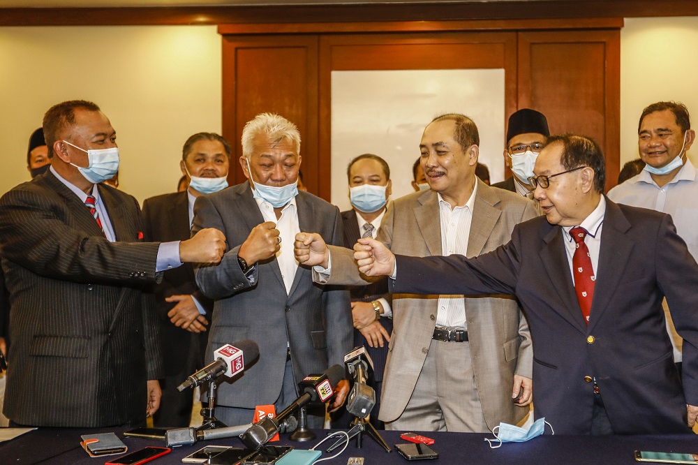 (From left) Jahid Jahim, Datuk Seri Bung Moktar Radin, Datuk Hajiji Noor and Datuk Jeffrey Kitingan pose for a photo after the press conference at Hotel Magellan in Kota Kinabalu September 28, 2020. u00e2u20acu201d Picture by Firdaus Latif