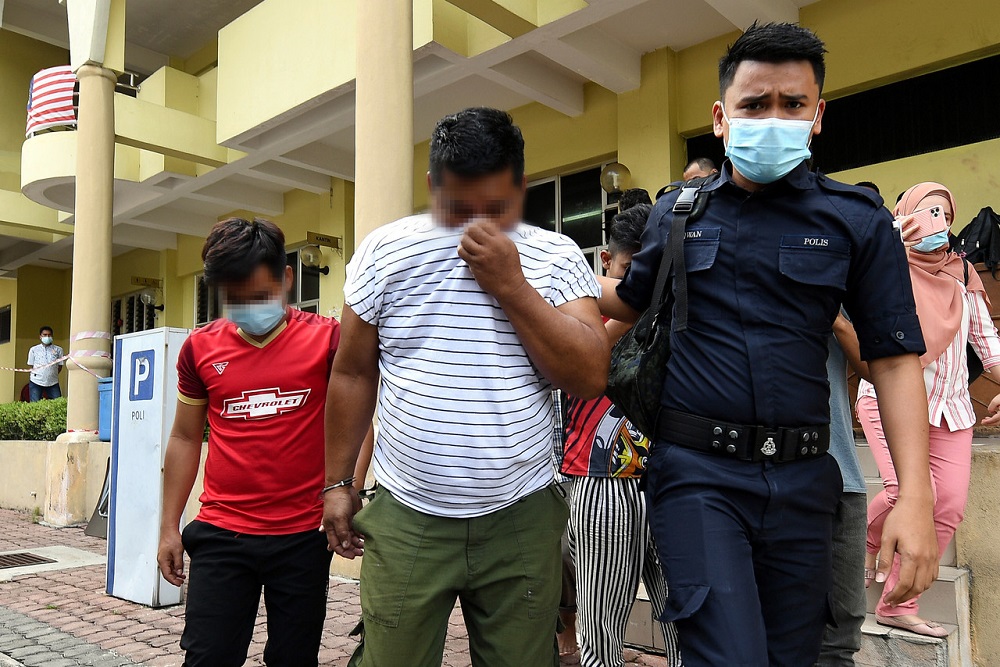 The two factory workers are led out of the Selayang Magistrateu00e2u20acu2122s Court in Kuala Lumpur September 7, 2020. u00e2u20acu201d Bernama pic
