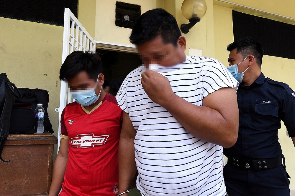 The two factory workers are led out of the Selayang Magistrateu00e2u20acu2122s Court in Kuala Lumpur September 7, 2020. u00e2u20acu201d Bernama pic