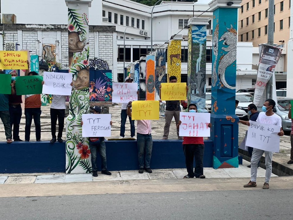 Demonstrators hold handmade placards in Kota Kinabalu demanding Sabah Governor Tun Juhar Mahiruddin decide quickly their next chief minister on September 28, 2020. u00e2u20acu201d Picture from social media 