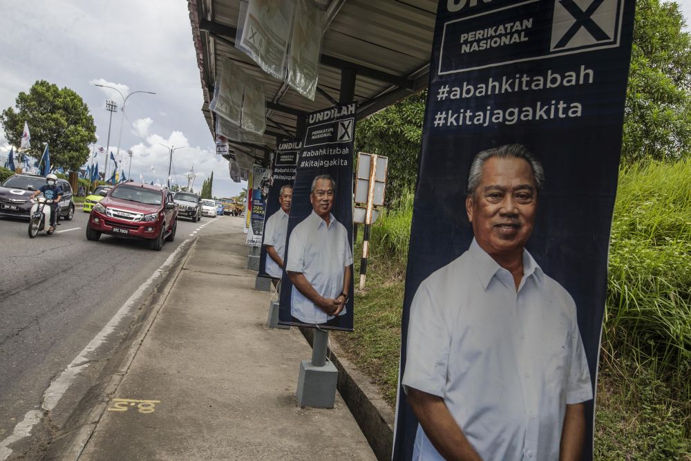 Election poster featuring Perikatan Nasional chairman Tan Sri Muhyiddin Yassin are seen in Keningau, Sabah September 24, 2020. u00e2u20acu201d Picture by Firdaus Latifnn