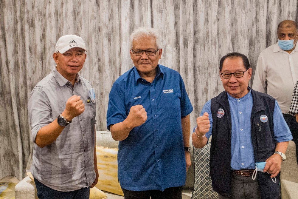 (From left) PBS secretary-general Jahid Jahim, Perikatan Nasional (PN) secretary-general Datuk Seri Hamzah Zainuddin and Sabah Parti Solidariti Tanah Airku (STAR) president Datuk Jeffrey Kitingan in Kota Kinabalu September 22, 2020. u00e2u20acu201d Picture by Firdaus