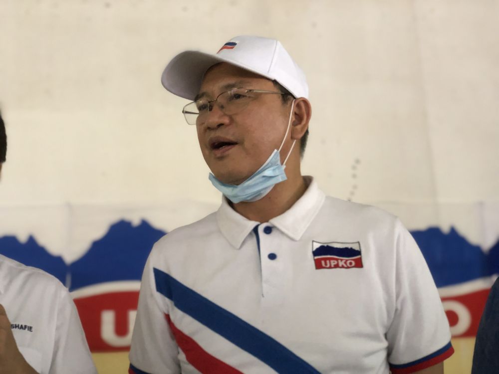 Datuk Seri Wilfred Madius Tangau speaks to reporters while campaigning in Kampung Lokub, Kota Kinabalu September 18, 2020. u00e2u20acu201d Picture by Emmanuel Santa Maria Chin