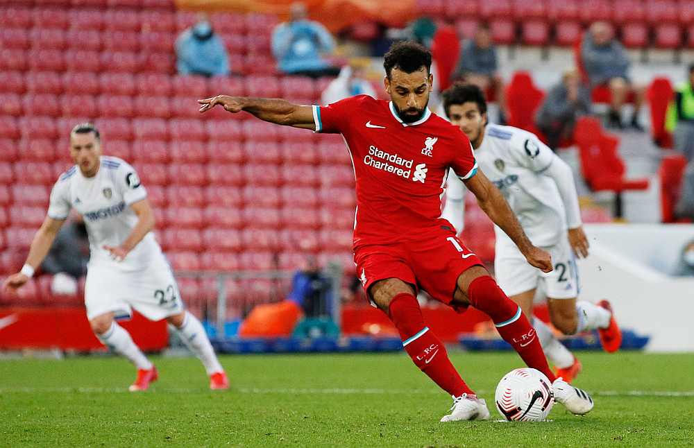 Liverpool's Mohamed Salah scores their fourth goal from the penalty spot to complete his hat-trick in the EPL match against Leeds United at Anfield, Liverpool, Britain September 12, 2020. u00e2u20acu201d Pool pic via Reuters