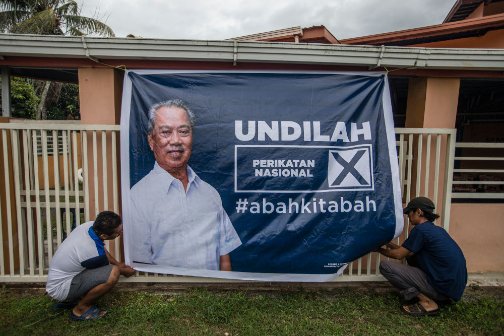 An election poster of Perikatan Nasional chairman Tan Sri Muhyiddin Yassin is seen in Pintasan, Kota Belud, Sabah, September 16, 2020. u00e2u20acu201d Picture by Firdaus Latif