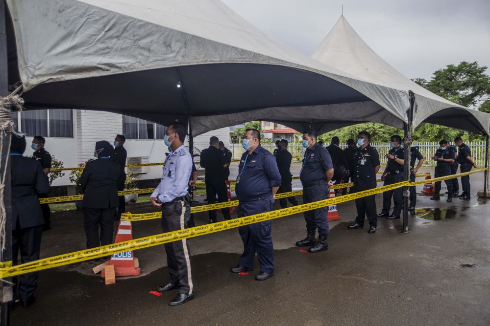 Police personnel wait to cast their votes during early voting for the Sabah state poll in Kota Kinabalu September 22, 2020. u00e2u20acu201d Picture by Firdaus Latif