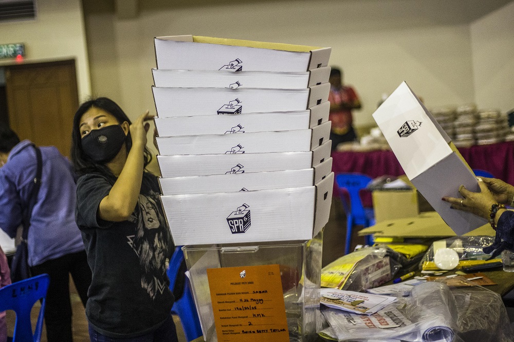 Election Commission personnel conduct final preparations at a polling centre ahead of the Sabah state election in Moyog September 25, 2020. u00e2u20acu2022 Picture by Firdaus Latif