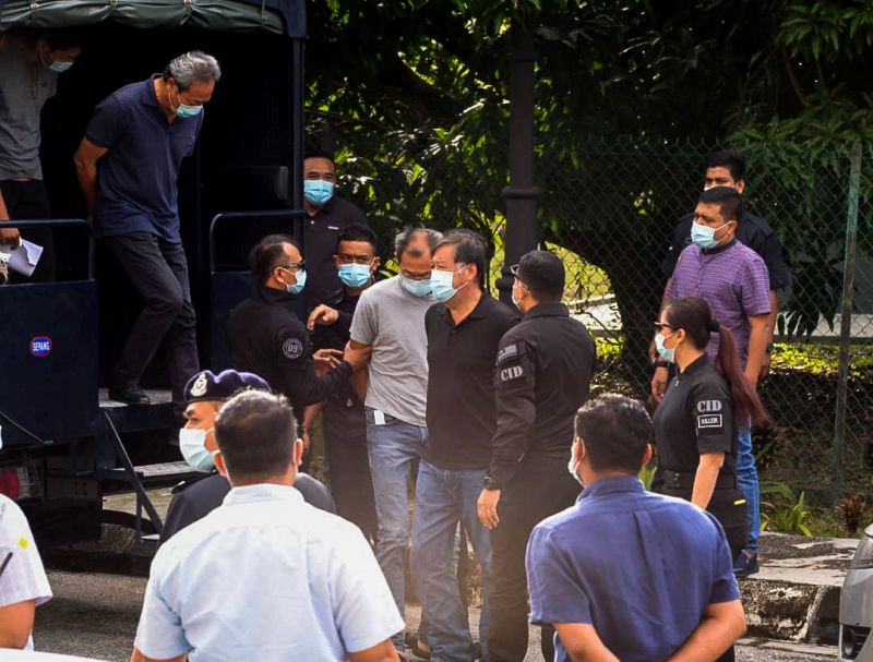 Four factory managers and a worker linked to the recent pollution of Sungai Gong arrive at the Selayang Magistrate's Court September 15, 2020. 