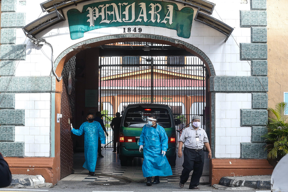 Staff at the Penang Remand Prison are seen in PPE suits after an inmate was confirmed to have contracted the Covid-19 virus, October 6. 2020. u00e2u20acu201d Picture by Sayuti Zainudin