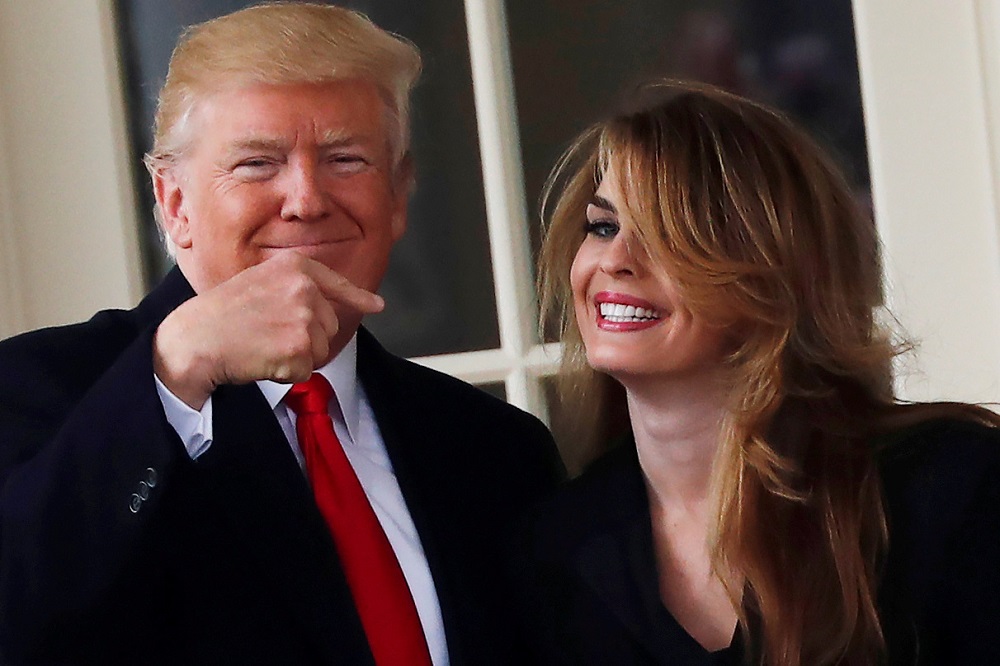 US President Donald Trump reacts as he stands next to former White House Communications Director Hope Hicks outside of the Oval Office in Washington March 29, 2018. u00e2u20acu201d Reuters pic 