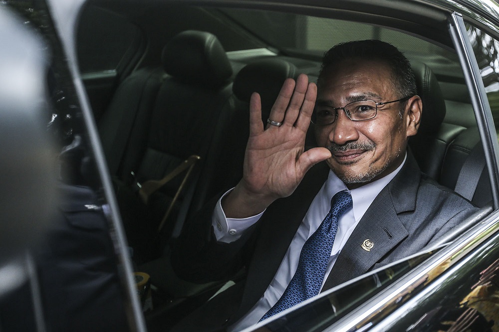 Foreign Minister Datuk Seri Hishammuddin Hussein waves at the press as he arrives at the Prime Ministeru00e2u20acu2122s Office in Putrajaya October 23, 2020. u00e2u20acu201d Picture by Hari Anggara