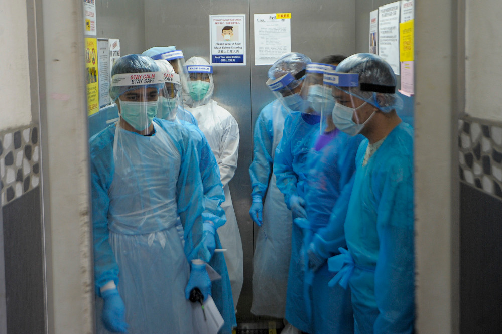 MOH healthcare workers carry out Covid-19 screening at Pelangi Damansara block in Petaling Jaya October 22, 2020. u00e2u20acu201d Picture by Shafwan Zaidon