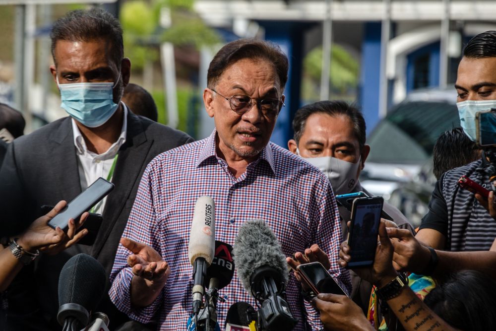 Datuk Seri Anwar Ibrahim speaks to reporters after giving his statement to the police at Bukit Aman in Kuala Lumpur October 16, 2020. u00e2u20acu201d Picture by Firdaus Latif