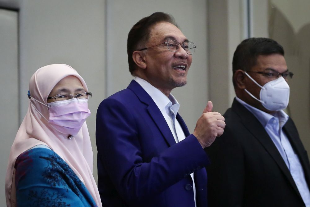 Datuk Seri Anwar Ibrahim (centre) gestures at reporters during a press conference at Le Meredian Kuala Lumpur October 13, 2020. u00e2u20acu201d Picture by Yusof Mat Isa