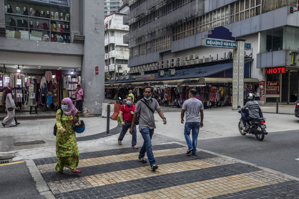 Members of the public walk along Jalan Tuanku Abdul Rahman amid the conditional movement control order in Kuala Lumpur October 23, 2020. u00e2u20acu201d Picture by Firdaus Latif