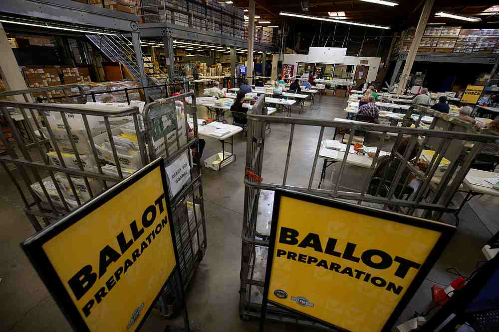 Some of the hundreds of thousands of early mail-in ballots are processed for scanning by election workers at the Orange County Registrar of Voters in Santa Ana, California, U.S., October 16, 2020. 