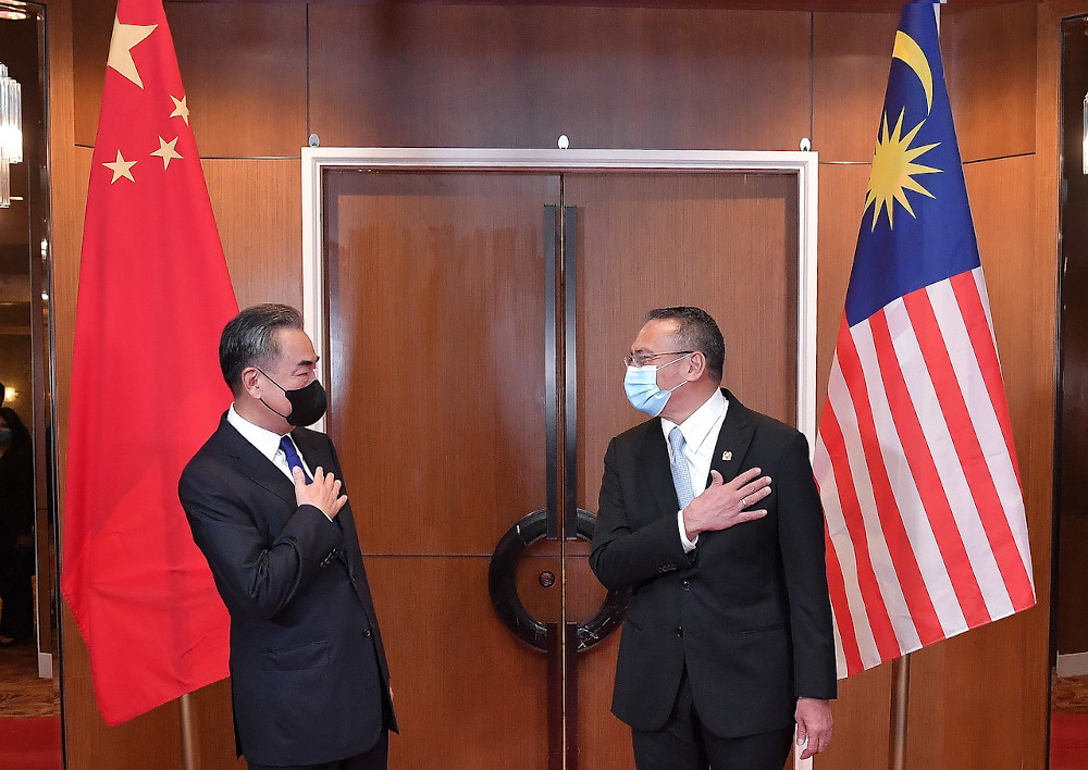 Foreign Minister Datuk Seri Hishammuddin Hussein welcomes his counterpart from China, Wang Yi before a bilateral meeting in Kuala Lumpur, October 13, 2020. u00e2u20acu201d Bernama pic