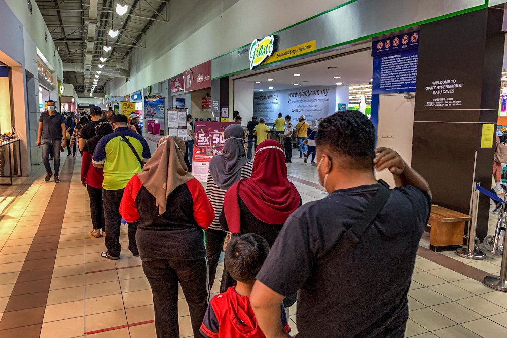 People visit the Giant supermarket in Batu Caves to stock up on some goods before conditional movement control order (CMCO) begins, October 13, 2020. u00e2u20acu201d Picture by Hari Anggara