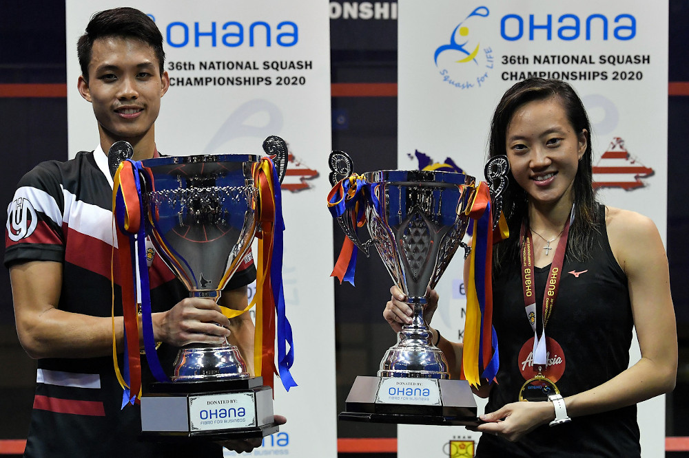 National number one players Ivan Yuen (left) and Low Wee Wern pose for a trophy after being crowned champions at the 36th National Squash Championship at the Bukit Jalil National Squash Centre, October 11, 2020. u00e2u20acu201d Bernama pic 