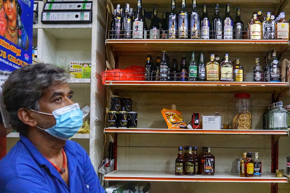 S. Rajan shows the liquor sold at his convenience shop in Kuala Lumpur November 19, 2020. u00e2u20acu201d Picture by Ahmad Zamzahuri