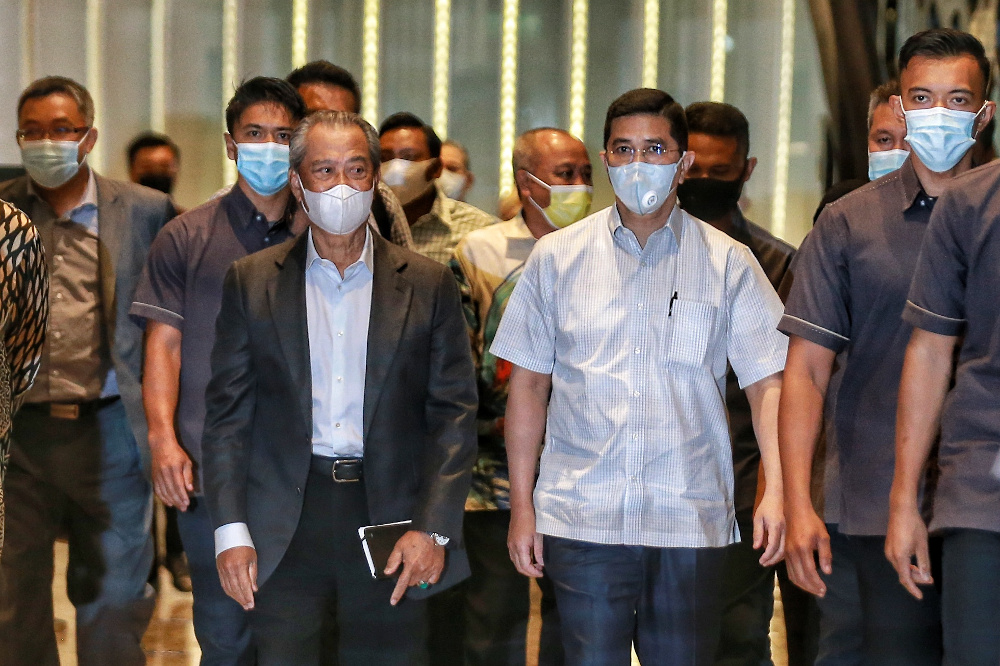 Prime Minister Tan Sri Muhyiddin Yassin and Datuk Seri Azmin Ali leave after a Perikatan Nasional meeting at the Hilton hotel in Kuala Lumpur November 1, 2020. u00e2u20acu201d Picture by Ahmad Zamzahuri