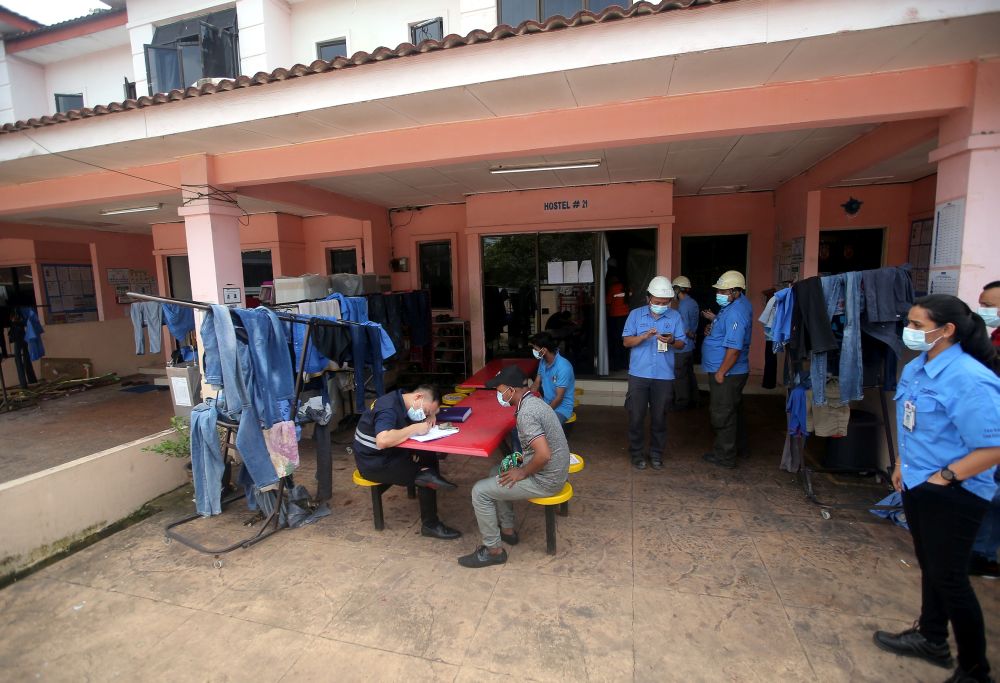 Officers from the Labour Department conduct checks on a workeru00e2u20acu2122s hostel in Tasek, Ipoh November 26, 2020. u00e2u20acu201d Picture by Farhan Najib