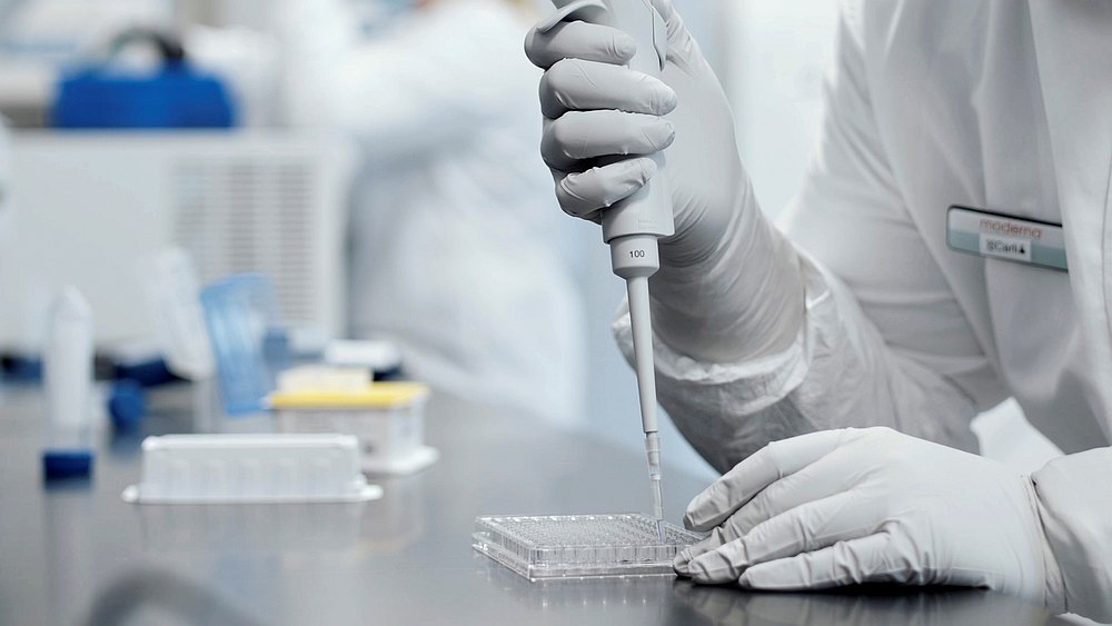 A researcher works in a lab run by Moderna Inc, a Covid-19 vaccine maker who has developed a reported 94.5 per cent vaccine based on late-stage clinical trial data, in this undated still video image. u00e2u20acu201du00e2u20acu201d Moderna Inc handout via Reuters 